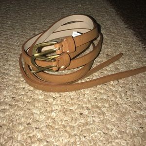 Set of TWO tan belts. Size medium/Large